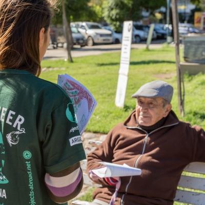 A Projects Abroad intern shares information with a local man as part of her Human Rights work experience in Argentina. A student speaks to a local man during a campaign on her Human Rights internship in Argentina.